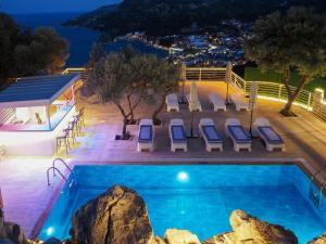 a pool at night with a view of a resort at Oliva Mare in Marmaris