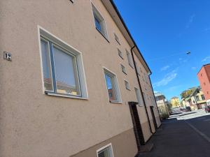 a building with windows on the side of a street at Malmi Home in Vaasa