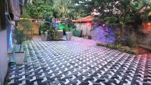 Κήπος έξω από το Palms Villa
