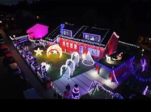 a house covered in christmas lights and decorations at Ferienwohnung Familie Schott in Schwaig bei Nürnberg