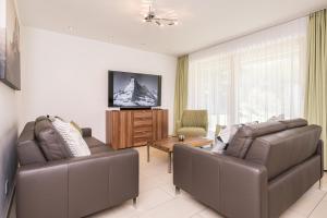 TV a/nebo společenská místnost v ubytování Ferienhaus Casa Luna