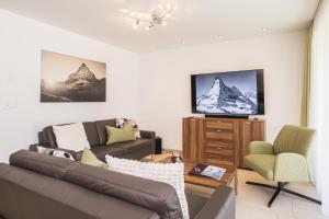 TV a/nebo společenská místnost v ubytování Ferienhaus Casa Luna