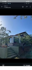 a screen shot of a house with stairs in front at Ulivi e Mare in Mesimvría