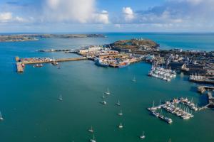 an aerial view of a harbor with boats in the water at Beautiful Georgian Apartment | Near Falmouth Town Centre | Walk to Shops, Pubs & Restaurants in Falmouth