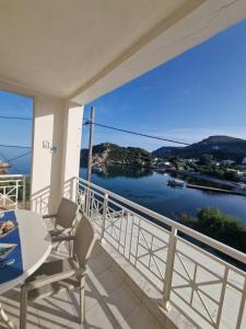 a balcony with a view of the water at Emporios Mansion in Emporeios