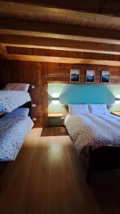 Postel nebo postele na pokoji v ubytování B&B Val Maschi