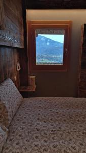 Postel nebo postele na pokoji v ubytování B&B Val Maschi