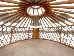 an inside view of a yurt with a window at Ko Terelj Resort in Yoliin Hural
