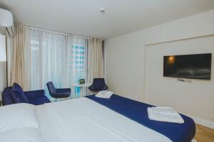 Postel nebo postele na pokoji v ubytování Panorama King Suite Sea View Hotel