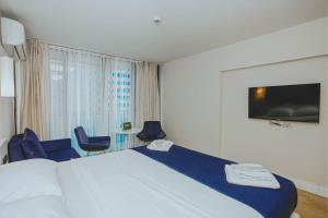 Postel nebo postele na pokoji v ubytování Panorama King Suite Sea View Hotel