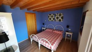 Postel nebo postele na pokoji v ubytování B&B Val Maschi