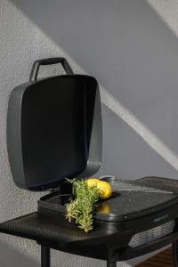 a computer monitor sitting on top of a table at Muse by the beach in Amoudara Lasithiou
