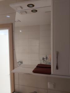 a bathroom with a mirror and a bath tub at HOMESTAY ,,Aurora,, in Vilnius +51 photos