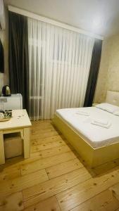 Postel nebo postele na pokoji v ubytování Hotel Old Boulvared