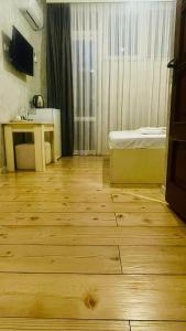 TV a/nebo společenská místnost v ubytování Hotel Old Boulvared