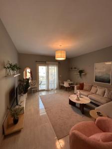 a living room with a couch and a table at Viva Coast Resort - El Galala - El Sokhna in Ain Sokhna