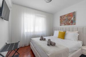 Katil atau katil-katil dalam bilik di Monero Boutique Apartment II