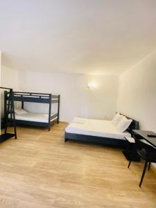 Postel nebo postele na pokoji v ubytování Canaan Hôtel Antsirabe
