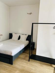 Postel nebo postele na pokoji v ubytování Canaan Hôtel Antsirabe
