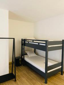 Postel nebo postele na pokoji v ubytování Canaan Hôtel Antsirabe