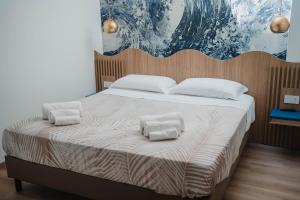 Letto o letti in una camera di Hotel Ficocella