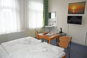 TV a/nebo společenská místnost v ubytování Appartementhaus Sellin