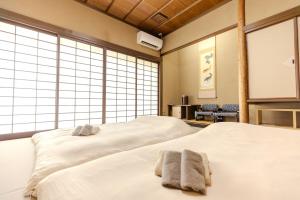 Postel nebo postele na pokoji v ubytování 逸仙居 Japanese Style House