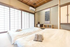 Postel nebo postele na pokoji v ubytování 逸仙居 Japanese Style House