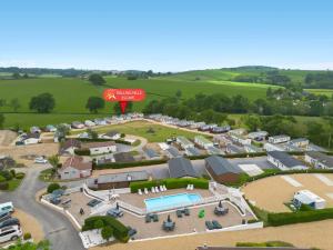 an aerial view of a campground with a pool at Rolling Hills Splash Escape - Fishing Nearby & Communal Swimming Pool ,Shut for the winter open April 2026 in Cheriton Bishop