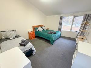 Postel nebo postele na pokoji v ubytování Jindy Base Camp