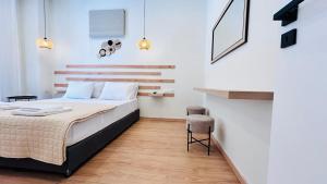 Postel nebo postele na pokoji v ubytování Eria's Junior Suite