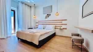 Postel nebo postele na pokoji v ubytování Eria's Junior Suite