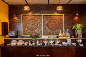 a buffet with plates of food on a table at Baan Krating Khao Lak Resort - SHA plus in Khao Lak +92 photos