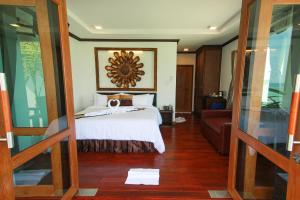Ліжко або ліжка в номері Cabana Lipe Beach Resort