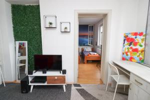 TV a/nebo společenská místnost v ubytování Square Apartments