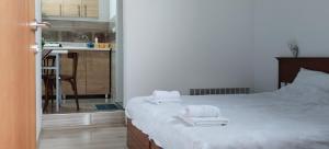 a bedroom with a bed with towels on it at SonAp Krusevo in Kruševo