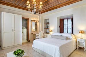 Ein Bett oder Betten in einem Zimmer der Unterkunft Mare Monte Luxury Suites