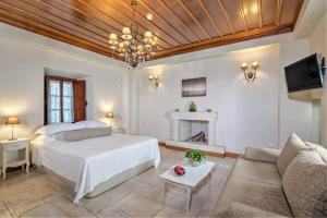 Ein Bett oder Betten in einem Zimmer der Unterkunft Mare Monte Luxury Suites