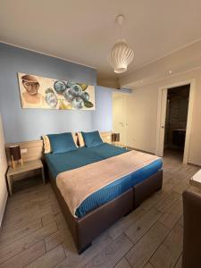 a bedroom with a large bed in a room at B&B Il Giardino Diamante in Diamante