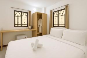 Postel nebo postele na pokoji v ubytování K&T Hotel - Bùi Viện Walking Street