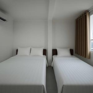 Postel nebo postele na pokoji v ubytování K&T Hotel - Bùi Viện Walking Street