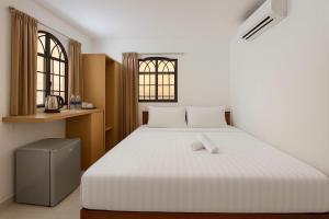 Postel nebo postele na pokoji v ubytování K&T Hotel - Bùi Viện Walking Street