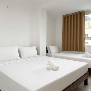 Postel nebo postele na pokoji v ubytování K&T Hotel - Bùi Viện Walking Street
