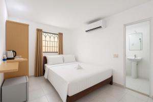 Postel nebo postele na pokoji v ubytování K&T Hotel - Bùi Viện Walking Street