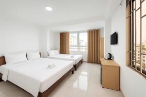 Postel nebo postele na pokoji v ubytování K&T Hotel - Bùi Viện Walking Street