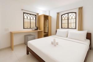 Postel nebo postele na pokoji v ubytování K&T Hotel - Bùi Viện Walking Street