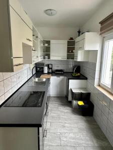 Kuchyň nebo kuchyňský kout v ubytování Apartmani More Krk