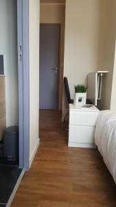 Llit o llits en una habitació de Hotel Belvue
