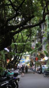 a group of motorcycles parked on a city street at Vietnam Travelers Home 2 with Cozy Private Balcony in Hanoi