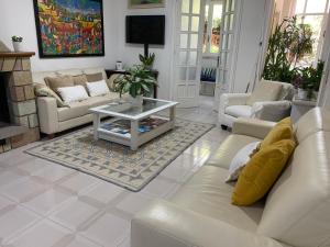 a living room with a couch and a table at Marco's house in Dolianova